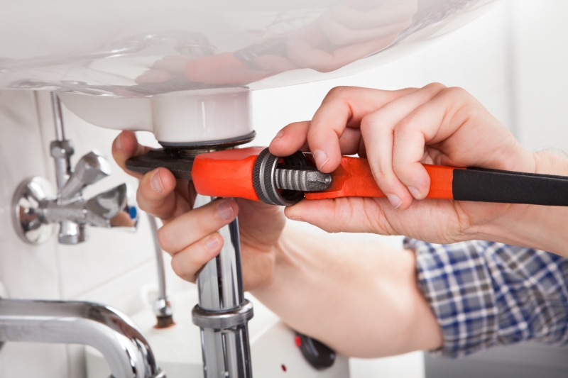 Emergency plumber attending a job in Acton